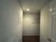 A walk-in closet with a metal rack, carpeted floor, and overhead lighting at 802 Crow View Ct, Woodstock, GA 30189