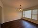 Bright dining room with wood floors, neutral paint, and lots of natural light at 802 Crow View Ct, Woodstock, GA 30189
