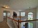 Inviting foyer featuring a stairway with an open railing and stylish chandelier at 802 Crow View Ct, Woodstock, GA 30189