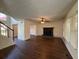Spacious living room featuring wood floors, fireplace, staircase, and neutral wall paint at 802 Crow View Ct, Woodstock, GA 30189