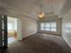 Expansive main bedroom featuring a vaulted ceiling, plush carpeting, and ample natural light at 802 Crow View Ct, Woodstock, GA 30189