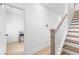 Bright entryway showcasing the staircase with wood treads and white risers and banister at , Atlanta, GA 30315