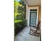Cozy balcony featuring comfortable rocking chairs and views of lush greenery at 1106 Stratford Commons, Decatur, GA 30033