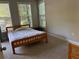 Bedroom featuring plush carpet, lots of natural light, and closet space at 1106 Stratford Commons, Decatur, GA 30033