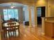 Open dining and living area featuring hardwood floors, large windows, and elegant architectural details at 1106 Stratford Commons, Decatur, GA 30033
