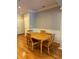 Hardwood flooring, wainscoting, and natural light complement the dining area's inviting ambiance at 1106 Stratford Commons, Decatur, GA 30033