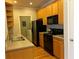 Galley kitchen features stainless steel appliances, ample cabinets and an adjacent laundry closet at 1106 Stratford Commons, Decatur, GA 30033