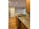 Open kitchen with tile backsplash, stainless steel sink, and lots of storage throughout at 1106 Stratford Commons, Decatur, GA 30033