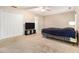 Bedroom featuring neutral walls, carpet, a closet, and large window at 165 Gingercake Ct, Fayetteville, GA 30214