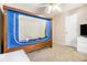 Bedroom featuring carpet, a ceiling fan, and a unique bed with a blue frame at 165 Gingercake Ct, Fayetteville, GA 30214