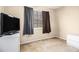 Modest bedroom featuring a television, bureau, carpet, and neutral walls at 165 Gingercake Ct, Fayetteville, GA 30214