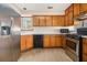 Functional kitchen with stainless steel appliances, light wood cabinets, and ample counter space for meal preparation at 165 Gingercake Ct, Fayetteville, GA 30214