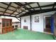 Covered back porch with dark wood trim, view to backyard and ceiling fan at 1852 E Farris Ave, Atlanta, GA 30344