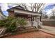 Charming home featuring a stone facade, covered front porch, and well-maintained landscaping at 1852 E Farris Ave, Atlanta, GA 30344