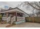 Charming home featuring a stone facade, covered front porch, and driveway at 1852 E Farris Ave, Atlanta, GA 30344