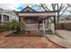 Charming home featuring a stone facade, covered front porch, and well-maintained landscaping at 1852 E Farris Ave, Atlanta, GA 30344