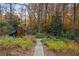 This large wooded backyard features mature trees, a playhouse and a firepit at 803 Courtenay Ne Dr, Atlanta, GA 30306