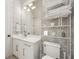 Bright bathroom featuring a white vanity, modern fixtures, patterned wallpaper, and ample storage with a stylish shelving unit at 803 Courtenay Ne Dr, Atlanta, GA 30306