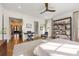 Large bedroom with hardwood floors, modern ceiling fan, and a relaxing reading nook area at 803 Courtenay Ne Dr, Atlanta, GA 30306