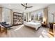 Spacious bedroom with large windows, natural light, modern ceiling fan, and an area for a reading nook at 803 Courtenay Ne Dr, Atlanta, GA 30306