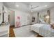 Spacious bedroom with hardwood floors, ensuite bath, and large window with natural light at 803 Courtenay Ne Dr, Atlanta, GA 30306