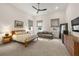 Spacious bedroom featuring a large bed, comfortable sitting area, and natural light at 803 Courtenay Ne Dr, Atlanta, GA 30306