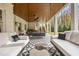 This covered patio features tile flooring, an outdoor ceiling fan and porch swing at 803 Courtenay Ne Dr, Atlanta, GA 30306