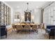 Bright dining room with a modern chandelier, large windows, and stylish decor at 803 Courtenay Ne Dr, Atlanta, GA 30306