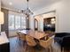 Stylish dining room featuring a modern chandelier, comfortable seating, and a view to office at 803 Courtenay Ne Dr, Atlanta, GA 30306