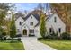 Stunning two-story brick home with a well-manicured lawn and inviting curb appeal at 803 Courtenay Ne Dr, Atlanta, GA 30306