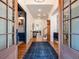 Inviting foyer with hardwood floors, stylish lighting, and beautiful architectural details at 803 Courtenay Ne Dr, Atlanta, GA 30306