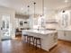 Elegant kitchen featuring a large island, pendant lighting, breakfast nook, and ample counter space at 803 Courtenay Ne Dr, Atlanta, GA 30306