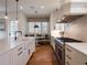 Well-lit kitchen with a breakfast nook, stainless steel appliances, and a large, functional island at 803 Courtenay Ne Dr, Atlanta, GA 30306