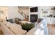 Comfortable living room featuring a large sectional, fireplace, and staircase to the upper level at 803 Courtenay Ne Dr, Atlanta, GA 30306
