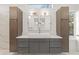 Bright bathroom featuring a large vanity with double mirrors and modern fixtures at 180 Railroad St, Canton, GA 30114