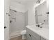 Modern bathroom featuring a gray vanity, walk-in shower, and contemporary fixtures at 180 Railroad St, Canton, GA 30114
