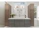 Bright bathroom featuring a large vanity with double mirrors and modern fixtures at 180 Railroad St, Canton, GA 30114