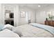 Bright bedroom boasts a walk-in closet, contemporary decor, and comfortable bedding at 180 Railroad St, Canton, GA 30114