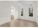 Light-filled bedroom with hardwood floors and an ensuite bathroom at 180 Railroad St, Canton, GA 30114