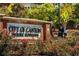 Welcoming sign for the City of Canton Historic Downtown amidst landscaped flowers at 180 Railroad St, Canton, GA 30114