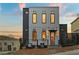 Modern two-story home featuring a sleek design with vertical siding and large windows at 180 Railroad St, Canton, GA 30114