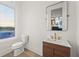 Modern powder room with stylish vanity, elegant fixtures, and bright natural light at 180 Railroad St, Canton, GA 30114