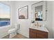 Modern powder room with stylish vanity, elegant fixtures, and bright natural light at 180 Railroad St, Canton, GA 30114