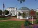 Beautiful white gazebo in a park with benches, landscaping, and a historic marker at 180 Railroad St, Canton, GA 30114