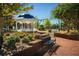 Picturesque white gazebo surrounded by benches, landscaping, and brick walkways at 180 Railroad St, Canton, GA 30114