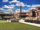 Scenic view of a grassy town park featuring a brick smokestack and amphitheater at 180 Railroad St, Canton, GA 30114