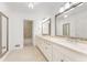 Spacious bathroom featuring dual sinks, large mirrors, tile floors and a separate shower at 3186 Sugarplum Ne Rd, Atlanta, GA 30345