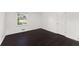 Bedroom boasts wood floors, neutral walls, and ample natural light from the window at 3186 Sugarplum Ne Rd, Atlanta, GA 30345