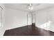 Bedroom with two entry doors, fan, and wood floors at 3186 Sugarplum Ne Rd, Atlanta, GA 30345