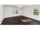Bedroom features dark floors and two large windows for natural light at 3186 Sugarplum Ne Rd, Atlanta, GA 30345